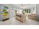 Sunroom with two couches and sliding doors leading to the backyard at 13027 Ne 7Th Loop, Silver Springs, FL 34488
