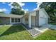 House exterior showcasing the front entrance and stone accents at 13027 Ne 7Th Loop, Silver Springs, FL 34488