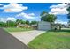 House exterior view showcasing a well-maintained lawn and driveway at 13027 Ne 7Th Loop, Silver Springs, FL 34488
