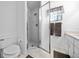 Bright bathroom with a shower stall and updated vanity at 13027 Ne 7Th Loop, Silver Springs, FL 34488