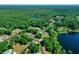 Aerial view showing property location near a lake and surrounding community at 13027 Ne 7Th Loop, Silver Springs, FL 34488