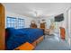 Main bedroom with a comfortable recliner and french doors at 13027 Ne 7Th Loop, Silver Springs, FL 34488