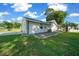 Side view of the house showing exterior with landscaping and driveway at 13027 Ne 7Th Loop, Silver Springs, FL 34488