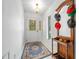 Bright entryway with tiled floor, stained glass door and hat rack at 13027 Ne 7Th Loop, Silver Springs, FL 34488