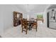 Bright dining room with a large table and access to the kitchen at 13027 Ne 7Th Loop, Silver Springs, FL 34488