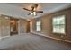 Spacious living room with ceiling fan and carpeted floors at 247 Malauka Loop, Ocklawaha, FL 32179