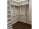 Large walk-in closet with ample shelving and hanging space at 2003 Odessa Cir, The Villages, FL 32162