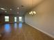 Spacious dining area with tile flooring and a chandelier at 4521 Sw 90Th Pl, Ocala, FL 34476