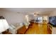 Spacious living room with hardwood floors, ceiling fan and large TV at 8420 Sw 92Nd St # A, Ocala, FL 34481