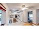 Galley kitchen with granite countertops and access to garage at 8420 Sw 92Nd St # A, Ocala, FL 34481