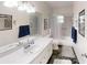 Bathroom with tub, vanity, and large mirror at 8420 Sw 92Nd St # A, Ocala, FL 34481