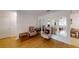 Living room featuring hardwood floors and arched mirrors at 8420 Sw 92Nd St # A, Ocala, FL 34481