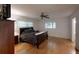 Main bedroom with a dark wood sleigh bed and hardwood floors at 8420 Sw 92Nd St # A, Ocala, FL 34481