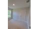 Spacious bedroom with a window and ample closet space at 7568 Sw 102Nd Loop, Ocala, FL 34476