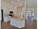 Modern kitchen with white cabinets, granite countertops, and an island at 7568 Sw 102Nd Loop, Ocala, FL 34476