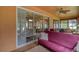 Relaxing screened porch with comfy seating and view of backyard at 9818 Sw 63Rd Loop, Ocala, FL 34481