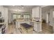 Bright kitchen features an island, stainless steel appliances, and ample cabinet space at 9818 Sw 63Rd Loop, Ocala, FL 34481