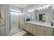 Bathroom boasts double sinks, a walk-in shower, and modern vanity at 9818 Sw 63Rd Loop, Ocala, FL 34481