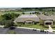Aerial view of community clubhouse with parking and landscaping at 9818 Sw 63Rd Loop, Ocala, FL 34481