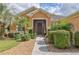 Inviting front entry with a screened door and walkway at 9818 Sw 63Rd Loop, Ocala, FL 34481