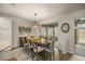 Dining room with large wooden table and access to the screened lanai at 9818 Sw 63Rd Loop, Ocala, FL 34481