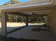 Covered patio with ceiling fan and spacious backyard at 7866 Sw 128Th Terrace Rd, Dunnellon, FL 34432