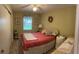 Bedroom with queen bed and neutral decor at 1161 Del Toro Dr, Lady Lake, FL 32159