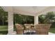 Peaceful patio with wicker furniture and lush greenery at Tbd Bay Dr, Ocklawaha, FL 32179