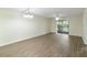 Spacious living room featuring wood-look floors and sliding glass doors to balcony at 2915 Sw 32Nd Ave # C3, Ocala, FL 34474