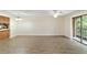 Spacious living room with wood-look floors and access to balcony and kitchen at 2915 Sw 32Nd Ave # C3, Ocala, FL 34474