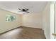 Bright bedroom with wood-look flooring and ceiling fan at 2915 Sw 32Nd Ave # C3, Ocala, FL 34474