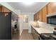 Modern kitchen featuring stainless steel appliances and light wood cabinets at 2915 Sw 32Nd Ave # C3, Ocala, FL 34474