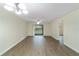 Bright living room with wood-look floors and access to balcony at 2915 Sw 32Nd Ave # C3, Ocala, FL 34474
