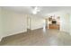 Living room with wood-look floors and kitchen access at 2915 Sw 32Nd Ave # C3, Ocala, FL 34474