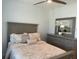 Charming bedroom with a ceiling fan and dresser at 8943 Lakeshore Pointe Drive, Winter Garden, FL 34787