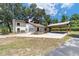 Two-story house with a carport and stone facade at 14260 Ne 40Th Ct, Anthony, FL 32617