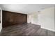 Spacious bedroom with wood accent wall and vinyl plank flooring at 14260 Ne 40Th Ct, Anthony, FL 32617