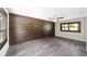 Spacious bedroom featuring wood-look flooring and an accent wall at 14260 Ne 40Th Ct, Anthony, FL 32617