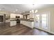 Modern kitchen featuring white cabinets, stainless steel appliances, and granite countertops at 14260 Ne 40Th Ct, Anthony, FL 32617