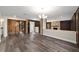 Spacious dining room with spiral staircase and hardwood floors at 14260 Ne 40Th Ct, Anthony, FL 32617