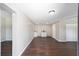 Interior view of an open space with laminate floors and a kitchenette at 14260 Ne 40Th Ct, Anthony, FL 32617