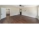 Spacious bedroom with wood-look floors and access to another room at 14260 Ne 40Th Ct, Anthony, FL 32617