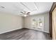 Bedroom with ceiling fan, access to deck, and vinyl plank flooring at 14260 Ne 40Th Ct, Anthony, FL 32617