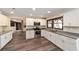 Renovated kitchen boasting white cabinets and granite countertops at 14260 Ne 40Th Ct, Anthony, FL 32617