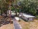 Aerial view of two houses and a long driveway at 14260 Ne 40Th Ct, Anthony, FL 32617