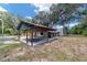 Home with attached carport and stone chimney at 14260 Ne 40Th Ct, Anthony, FL 32617