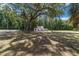 Small home with a large tree in front at 14260 Ne 40Th Ct, Anthony, FL 32617
