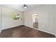 Simple bedroom with wood-look floors and window looking out to nature at 14260 Ne 40Th Ct, Anthony, FL 32617