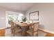 Spacious dining room with a wooden table and access to the patio at Tbd Bay Ct Pl, Ocklawaha, FL 32179