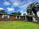 Brick home with carport and lush landscaping at 3204 Se 34Th St, Ocala, FL 34471